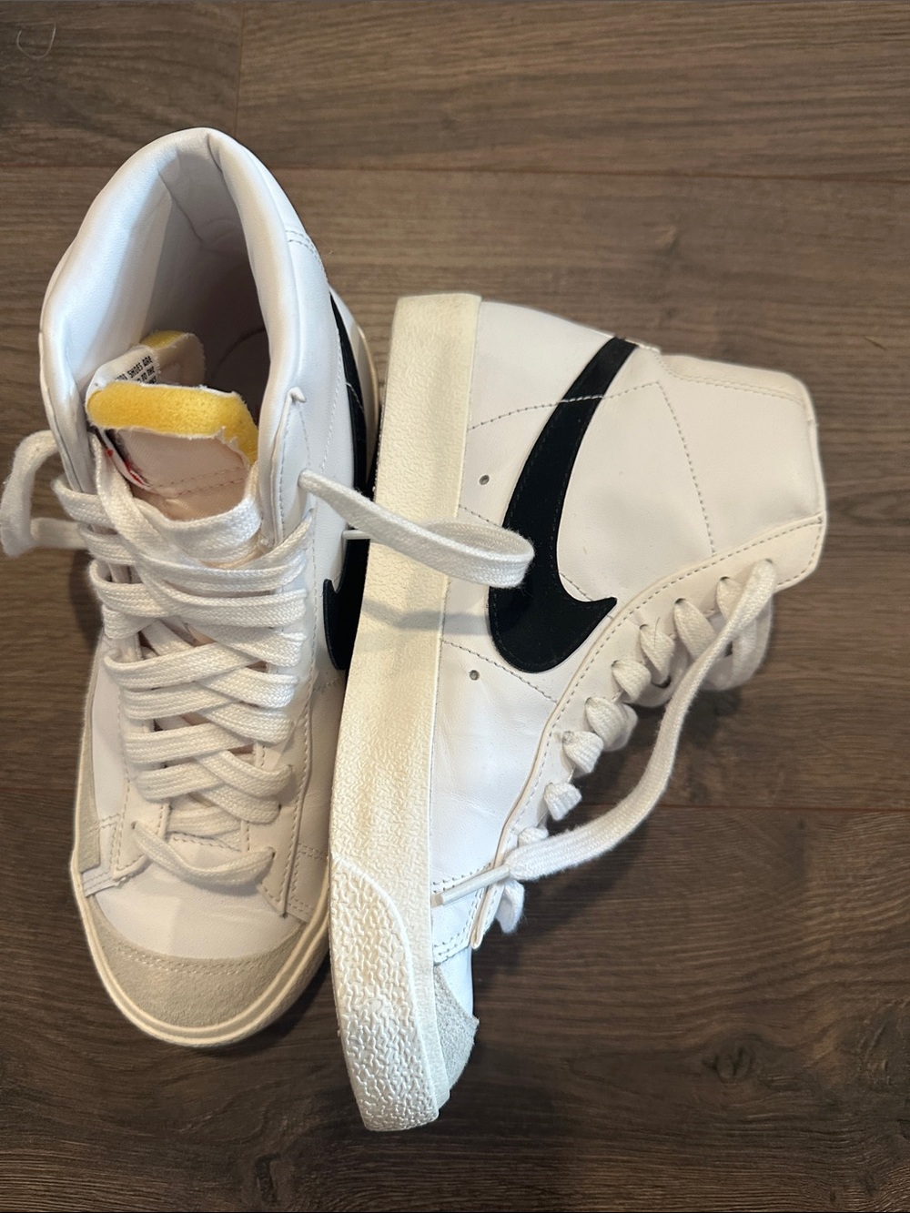 Nike Women's White High-Top Sneakers with Black Swoosh